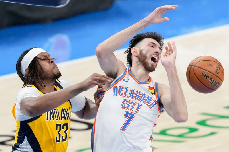 Indiana Pacers center Myles Turner (33) guards Oklahoma City Thunder forward Chet Holmgren (7) as he goes up at the net Thursday, June 5, 2025, during Game 1 of the NBA Finals against the Oklahoma City Thunder at Paycom Center in Oklahoma City.