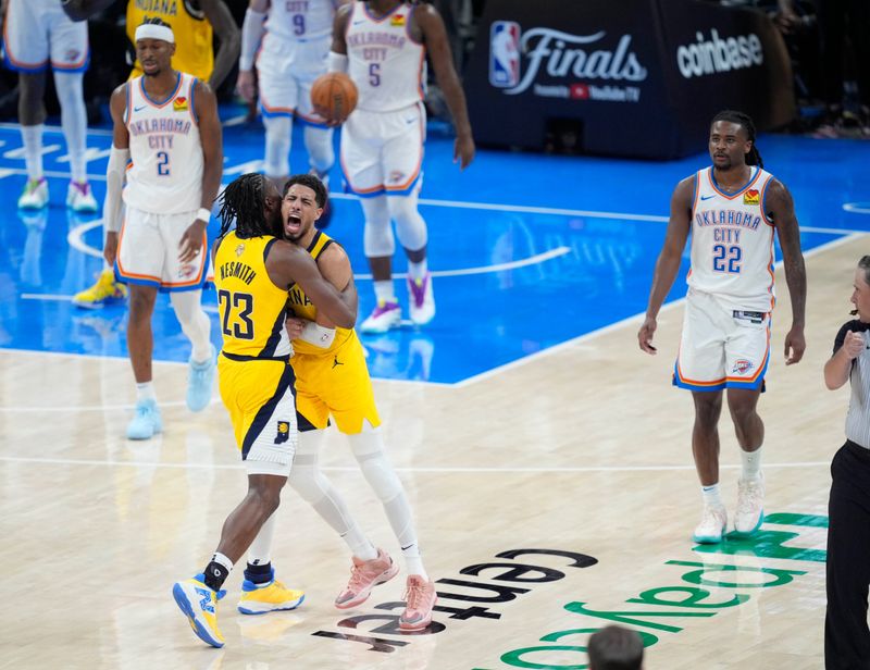 Indiana Pacers guard Tyrese Haliburton (0) and Indiana Pacers forward Aaron Nesmith (23) celebrate after Haliburton made a basket to give the Pacers a one point lead in the final second of Game 1 of the NBA Finals between the Oklahoma City Thunder and the Indiana Pacers at Paycom Center in Oklahoma City, Thursday, June 5, 2025. Indiana won 111-110.