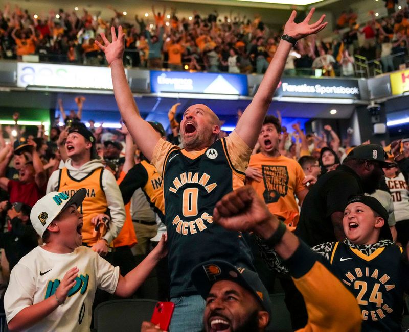Fans celebrate Thursday, June 5, 2025, after a watch party at Gainbridge Fieldhouse for Game 1 of the NBA Finals between the Indiana Pacers and the Oklahoma City Thunder. The Indiana Pacers defeated the Oklahoma City Thunder, 111-110.