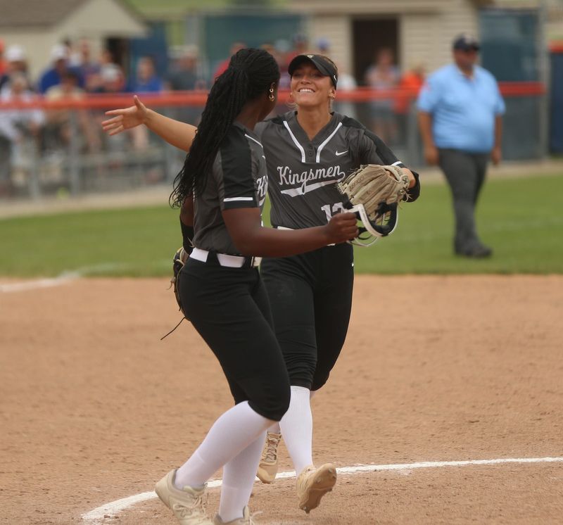 Penn senior Ava Zachary runs to hug junior Caitlyn Denny after the Kingsmen beat Harrison, 5-4, in an IHSAA Class 4A softball semi-state semifinal game Saturday, June 7, 2025, at Harrison High School in West Lafayette.