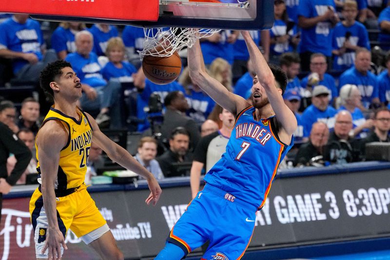 Jun 8, 2025; Oklahoma City, Oklahoma, USA; Oklahoma City Thunder forward Chet Holmgren (7) dunks the ball past Indiana Pacers guard Ben Sheppard (26) during the second quarter of game two of the 2025 NBA Finals at Paycom Center. Mandatory Credit: Kyle Terada-Imagn Images