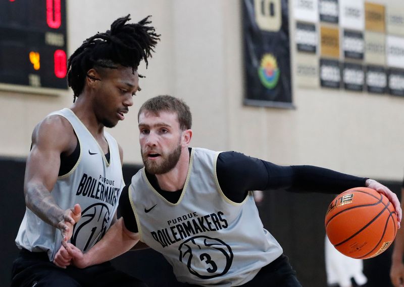 Purdue Boilermakers guard Antione West Jr. (1) defends Purdue Boilermakers guard Braden Smith (3) Monday, June 9, 2025, during practice at Cardinal Court in West Lafayette, Indiana.