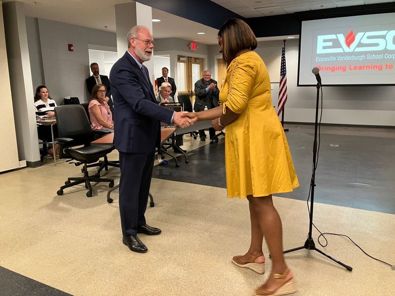 Evansville Mayor Stephanie Terry congratulates outgoing EVSC Superintendent David Smith.