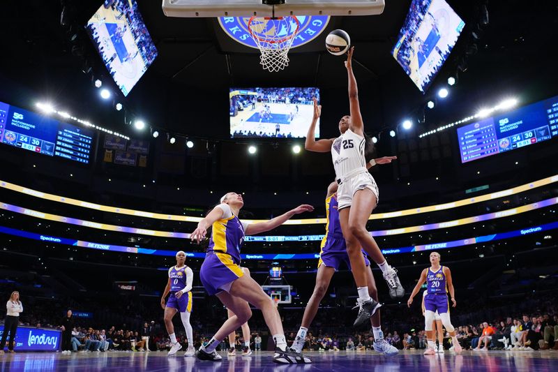Jun 9, 2025; Los Angeles, California, USA; Golden State Valkyries forward Monique Billings (25) shoots the ball against LA Sparks forward Dearica Hamby (5) and forward Azura Stevens (23) in the first half at Crypto.com Arena. Mandatory Credit: Kirby Lee-Imagn Images