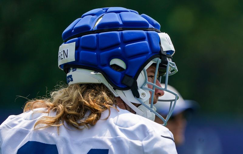 Indianapolis Colts tight end Tyler Warren (84) walks off the field Tuesday, June 10, 2025, during NFL Colts mandatory mini camp at the Indiana Farm Bureau Football Center in Indianapolis.
