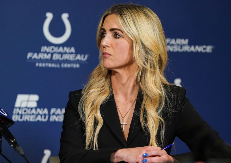 Casey Foyt listens to her sisters talk Tuesday, June 10, 2025, during a press conference at the Indiana Farm Bureau Football Center in Indianapolis.