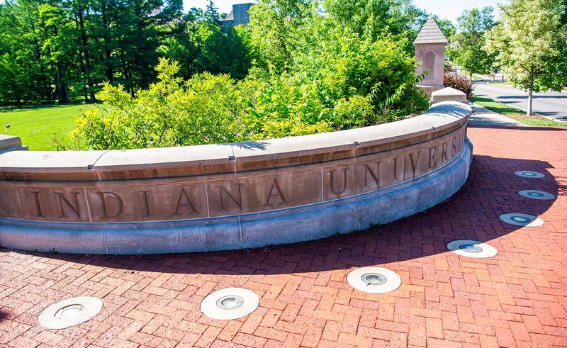 The carved Indiana University on the corner of Indiana Avenue and Seventh Street on the Indiana University campus on Friday, May 23, 2025.