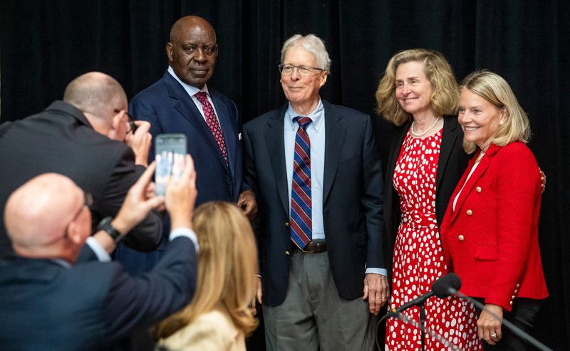 Newly appointed trustee James Bopp, Jr., middle, poses with Chair Quiinn Buckner, left, Indiana University President Pamela Whitten, second from right, and Vice Chair Cindy Lucchese, right, after being sworn in during the Indiana University Board of Trustees meeting in the Henke Hall of Champions at Memorial Stadium at Indiana University - Bloomington on Thursday, June 12, 2025.