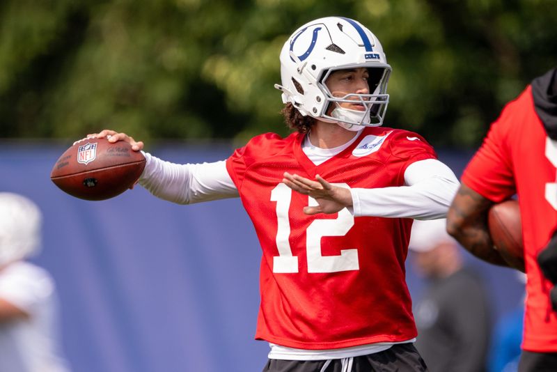 Jun 12, 2025; Indianapolis, IN, USA; Indianapolis Colts quarterback Jason Bean (12) throws a ball during training camp at the Farm Bureau Football complex. Mandatory Credit: Marc Lebryk-Imagn Images