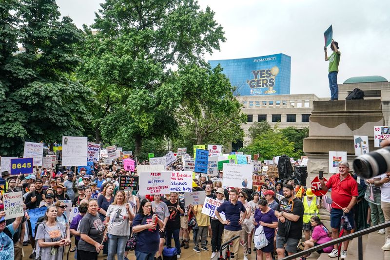 Protesters chant and march on Saturday, June 14, 2025, during a 'No Kings' protest at the Indiana Statehouse in Indianapolis.
