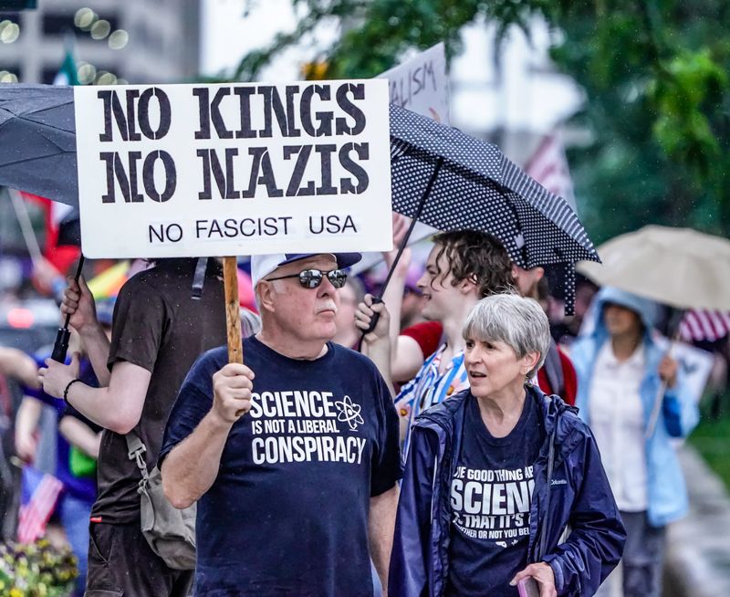 Protesters chant and march on Saturday, June 14, 2025, during a 'No Kings' protest at the Indiana Statehouse in Indianapolis.