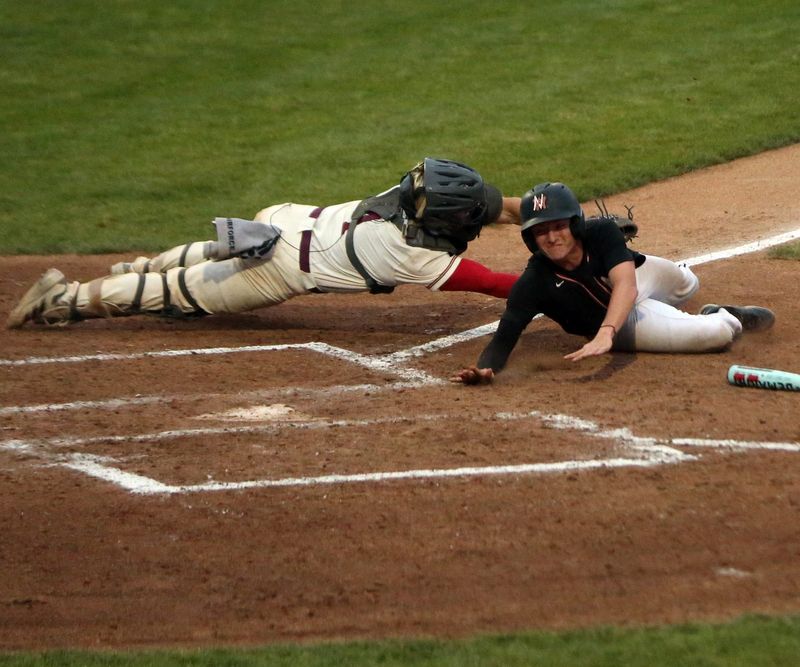 Andrean senior catcher Blake Kouder tags out NorthWood senior Ty Stankovich on a play at the plate during an IHSAA Class 3A baseball semi-state championship game Saturday, June 14, 2025, at LaPorte High School. NorthWood was trying to score on a suicide squeeze bunt attempt, but failed.