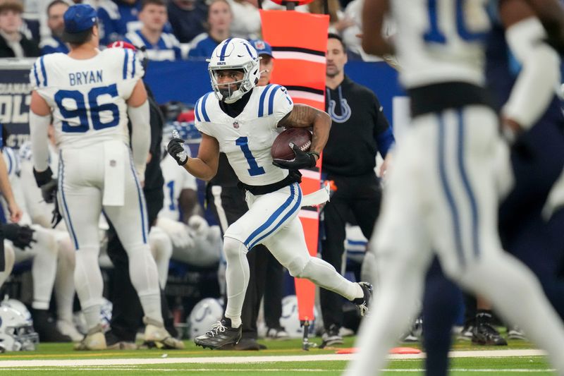 Dec 22, 2024; Indianapolis, Indiana, USA; Indianapolis Colts wide receiver Josh Downs (1) rushes the ball during a game against the Tennessee Titan at Lucas Oil Stadium. Mandatory Credit: Christine Tannous/USA Today Network via Imagn Images