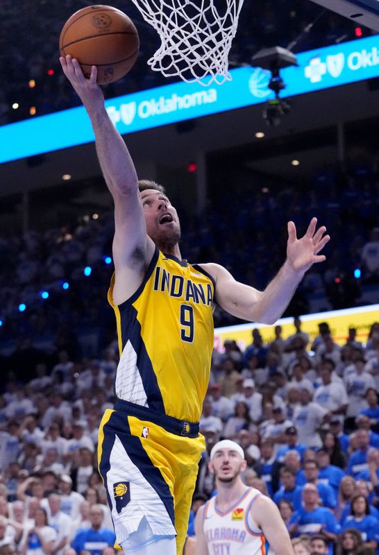 Indiana Pacers guard T.J. McConnell (9) goes up for the layup Monday, June 16, 2025, against the Oklahoma City Thunder during Game 5 of the NBA Finals at Paycom Center in Oklahoma City.