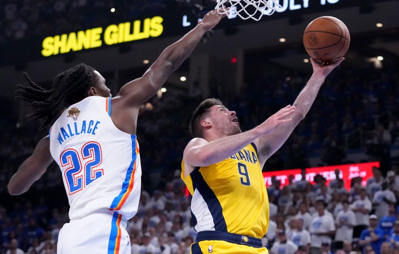 Indiana Pacers guard T.J. McConnell (9) lays the ball up Monday, June 16, 2025, during Game 5 of the NBA Finals at Paycom Center in Oklahoma City.