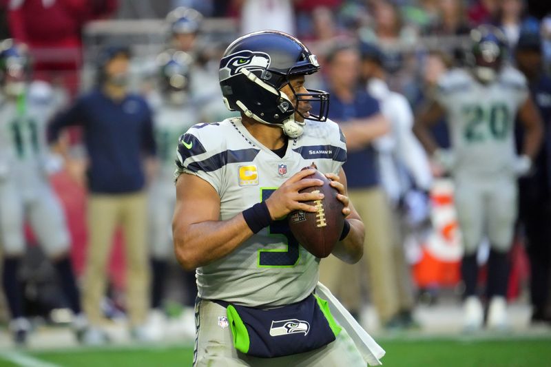 Jan 9, 2022; Glendale, Arizona, USA; Seattle Seahawks quarterback Russell Wilson (3) drops back to pass against the Arizona Cardinals during the second half at State Farm Stadium. Mandatory Credit: Joe Camporeale-USA TODAY Sports