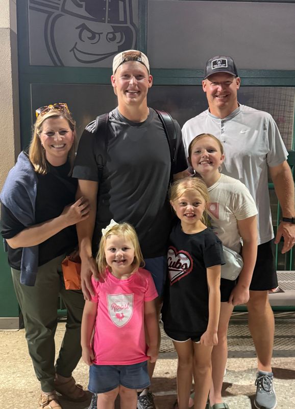 AJ Risedorph, back right, and his family take a picture with AJ's younger brother, Brayden, who is part of the South Bend Cubs organization, following a baseball game in Fort Wayne June 11, 2025.