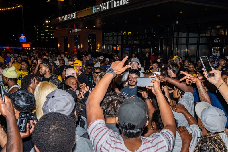 Fans celebrate outside the arena Thursday, June 19, 2025, after the Indiana Pacers defeated the Oklahoma City Thunder, 108-91, in Game 6 of the NBA Finals at Gainbridge Fieldhouse in Indianapolis.