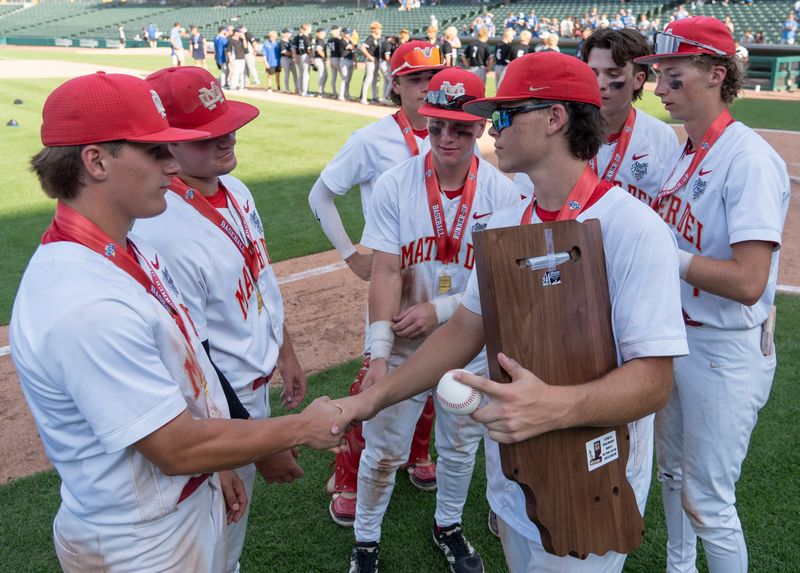 The Evansville Mater Dei Wildcats accept the runner up trophy Saturday, June 21, 2025, after the IHSAA class 2A baseball state final in Indianapolis.