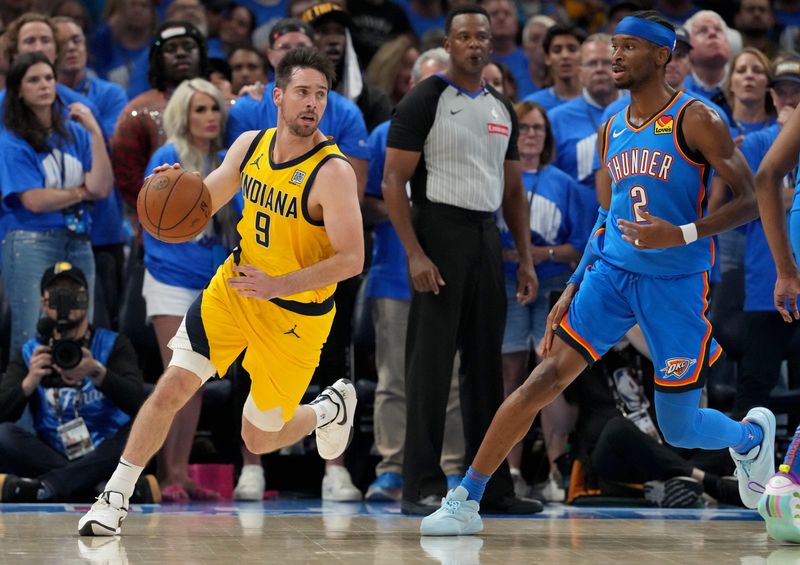 Indiana Pacers guard T.J. McConnell (9) dribbles out from under the basket Sunday, June 22, 2025, during Game 7 of the NBA Finals at Paycom Center in Oklahoma City.