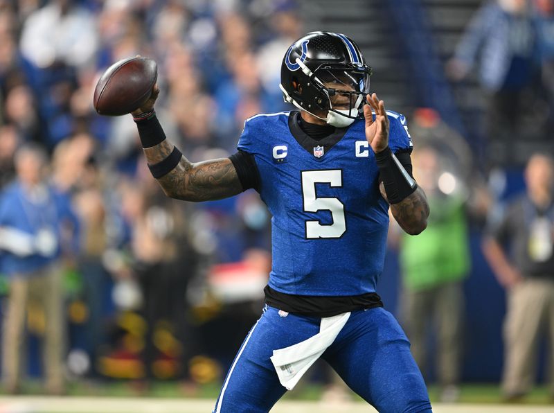 Indianapolis Colts quarterback Anthony Richardson (5) throws a pass during the first quarter against the Detroit Lions at Lucas Oil Stadium.