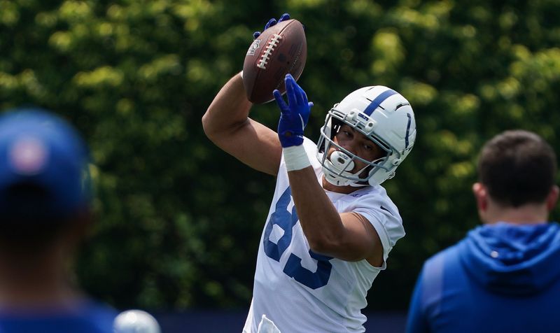 Indianapolis Colts tight end Albert Okwuegbunam Jr. (83) states the ball Tuesday, June 10, 2025, during NFL Colts mandatory mini camp at the Indiana Farm Bureau Football Center in Indianapolis.