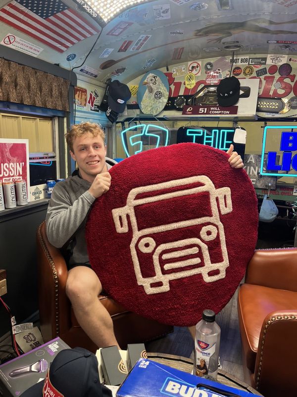 Ball State linebacker Jack Beebe delivered a custom rug to the Bussin' with the Boys podcast studio in Nashville, Tenn.