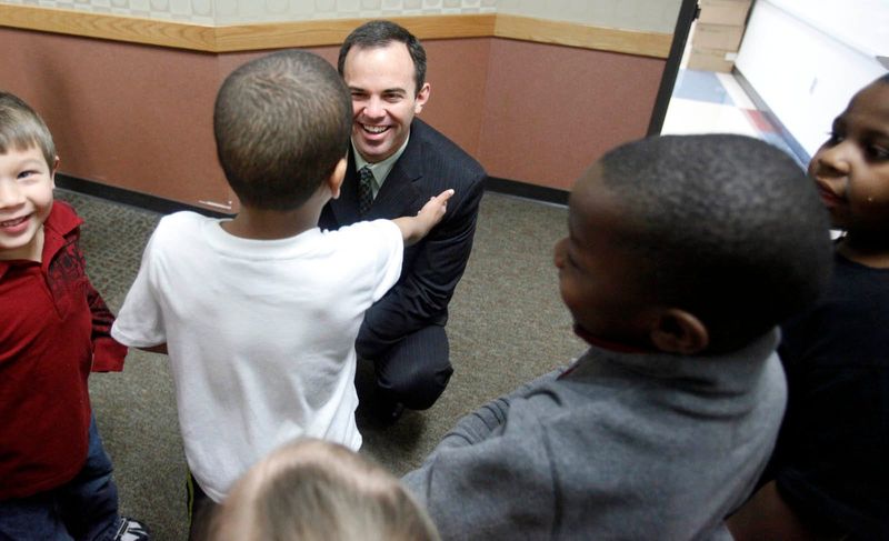 Jeff Butts, the new superintendent of Wayne Township, greets children in the hallway of Bridgeport Elementary Friday, January 14, 2011. Butts announced his plans to retire from the district on January 2026 after serving in the role for 14 years.