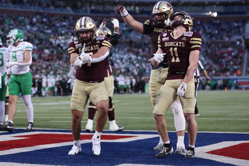Texas State Bobcats running back Lincoln Pare celebrates after scoring a touchdown.