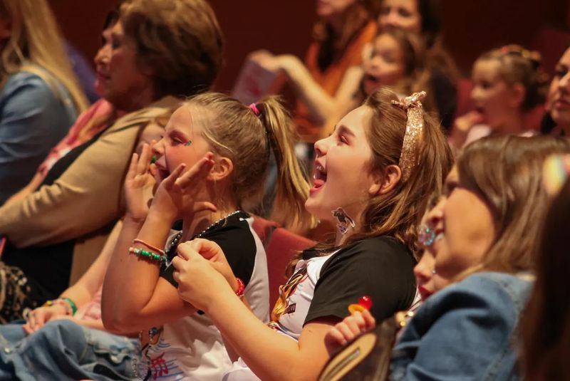 Young swifties cheer on the Bejeweled Band during Bloomington's first Swifty Fest on Sep. 8, 2024.