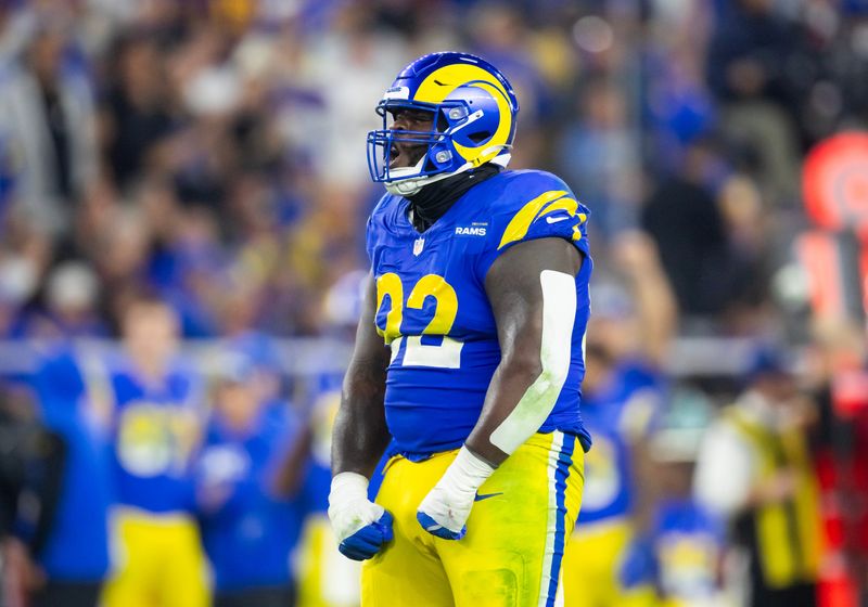 Jan 13, 2025; Glendale, AZ, USA; Los Angeles Rams defensive tackle Neville Gallimore (92) celebrates a play against the Minnesota Vikings during an NFC wild card game at State Farm Stadium. Mandatory Credit: Mark J. Rebilas-Imagn Images