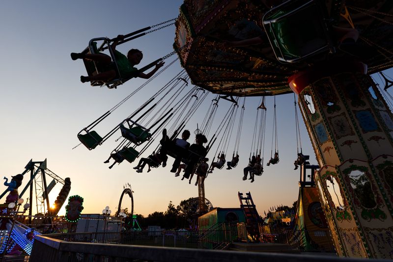 Fairgoers ride on swings at the St. Joseph County 4-H Fair at the county fairgrounds on Wednesday, July 2, 2025, in South Bend.