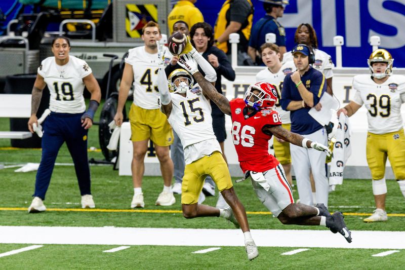 Jan 2, 2025; New Orleans, LA, USA; Georgia Bulldogs wide receiver Dillon Bell (86) blocks a pass almost intercepted by Notre Dame Fighting Irish cornerback Leonard Moore (15) during the second half at Caesars Superdome. Mandatory Credit: Stephen Lew-Imagn Images