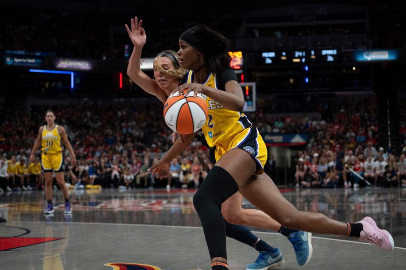 Indiana Fever guard Lexie Hull (10) guards Los Angeles Sparks forward Rickea Jackson (2) Saturday, July 5, 2025, at Gainbridge Fieldhouse in Indianapolis.