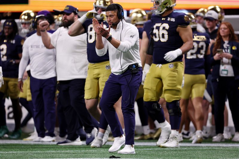 Jan 20, 2025; Atlanta, GA, USA; Notre Dame head coach Marcus Freeman reacts after a play against Ohio State during the second half the CFP National Championship college football game at Mercedes-Benz Stadium. Mandatory Credit: Brett Davis-Imagn Images