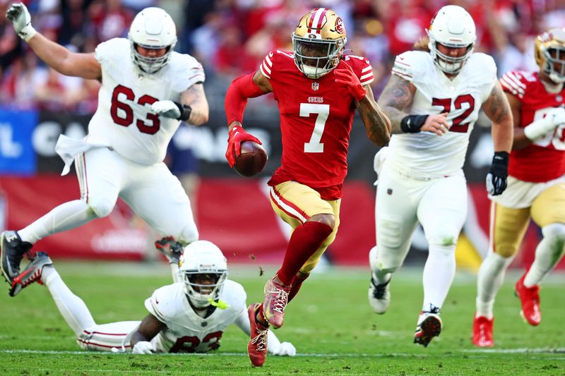 Dec 17, 2023; Glendale, Arizona, USA; San Francisco 49ers cornerback Charvarius Ward (7) runs back an interceptions for a touchdown during the first quarter against the Arizona Cardinals at State Farm Stadium. Mandatory Credit: Mark J. Rebilas-USA TODAY Sports