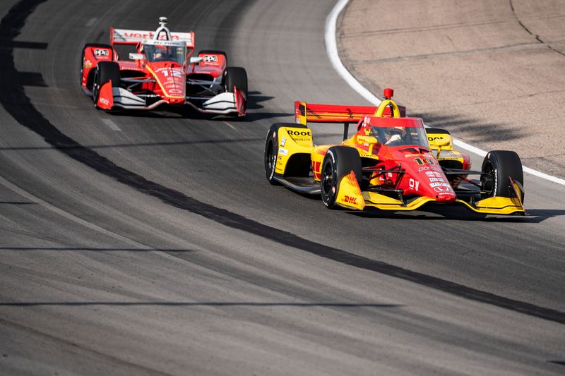 Alex Palou (10) goes through turns three and four during the NTT IndyCar Series Synk 275 on July 12, 2025, at Iowa Speedway in Newton, Iowa. Pato O'Ward (5) finished first.