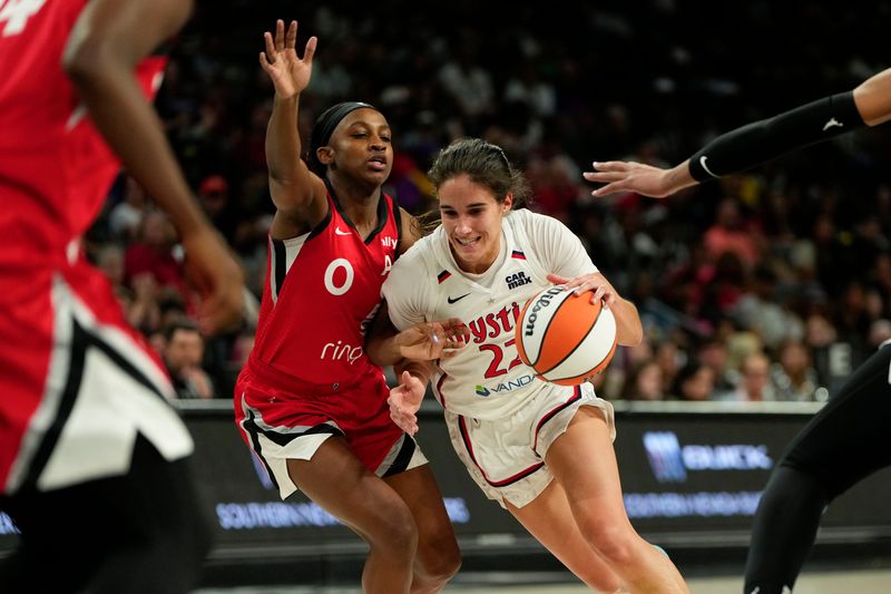 Jun 26, 2025; Las Vegas, Nevada, USA; Washington Mystics guard Sonia Citron (22) drives the ball past Las Vegas Aces guard Jackie Young (0) during the second half of a WNBA basketball game at Michelob Ultra Arena. Mandatory Credit: Lucas Peltier-Imagn Images