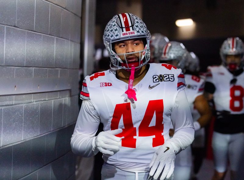 Jan 20, 2025; Atlanta, GA, USA; Ohio State Buckeyes defensive end JT Tuimoloau (44) against the Notre Dame Fighting Irish during the CFP National Championship college football game at Mercedes-Benz Stadium. Mandatory Credit: Mark J. Rebilas-Imagn Images