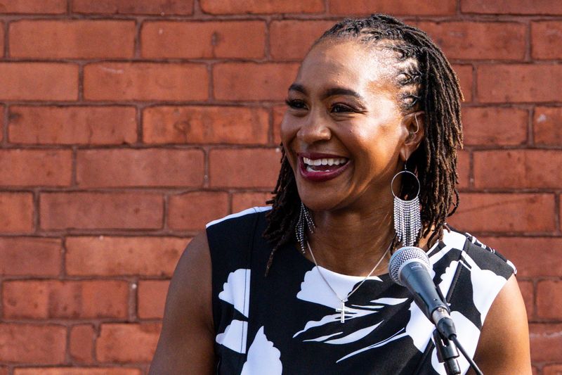 Indiana Fever legend Tamika Catchings gives a speech Wednesday, July 16, 2025, during the ribbon-cutting ceremony for a mural of Catchings in the Mass Ave neighborhood in Indianapolis. Muralist Nate Baranowski and apprentice Brooke McGee worked on the mural that portrays Catchings’ impact in Indianapolis.