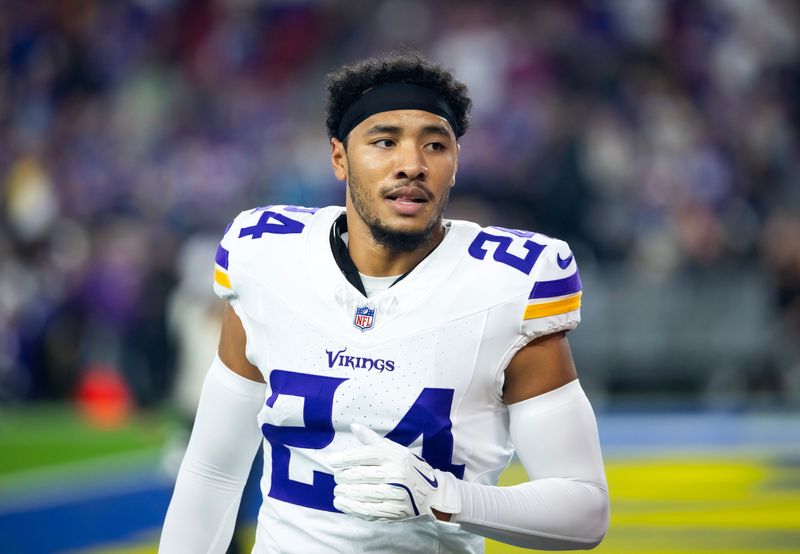 Jan 13, 2025; Glendale, AZ, USA; Minnesota Vikings safety Camryn Bynum (24) against the Los Angeles Rams during an NFC wild card game at State Farm Stadium. Mandatory Credit: Mark J. Rebilas-Imagn Images