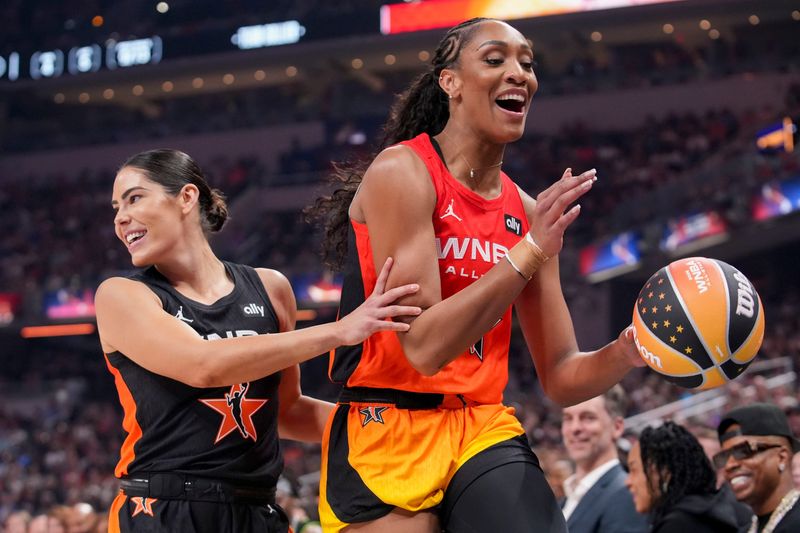 Los Angeles Sparks's Kelsey Plum (10) guards Las Vegas Aces' A’ja Wilson (22) on Saturday, July 19, 2025, during the WNBA All-Star Game at Gainbridge Fieldhouse in Indianapolis.