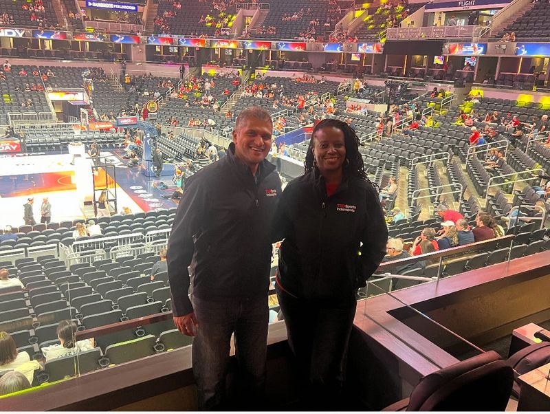 Neelay Bhatt and Monique Ruff-Bell are pictured at the WNBA All-Star game on July 19 in Indianapolis.