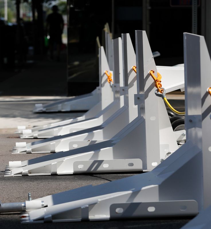 The Lafayette Police Department sets up a new barrier system to use for events downtown Tuesday, July 22, 2025, along Main Street in Lafayette, Indiana.