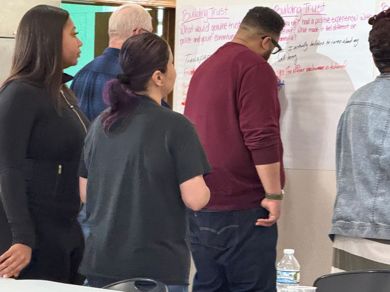 North District residents answer questions at the Taylor Advising listening session for Indianapolis Metropolitan Police Department's strategic plan at the Brightwood Community Center in Indianapolis on June 28, 2025.
