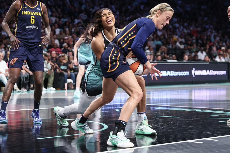 Jul 22, 2025; Brooklyn, New York, USA; New York Liberty forward Isabelle Harrison (21) and Indiana Fever guard Sophie Cunningham (8) fight for a loose ball in the second quarter at Barclays Center.