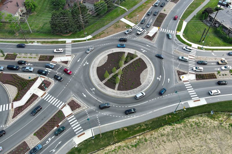 Cars enter a roundabout Wednesday, July 23, 2025, at the intersection of 96th Street and Allisonville Road in Fishers.
