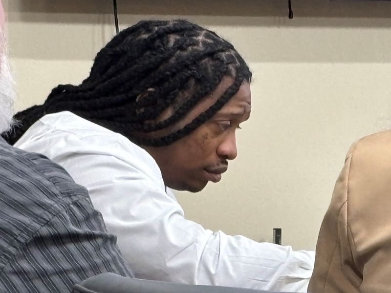 Montrell Jolly looks over his notes Thursday, July 24, 2025, during the third day of his murder trial. He is accused of beating his cousin's 4-year-old son, causing the injuries that killed the boy.
