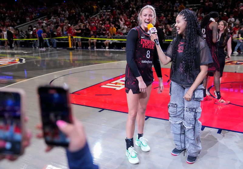 Indiana Fever guard Sophie Cunningham (8) is interviewed after the game Thursday, July 24, 2025, during the game at Gainbridge Fieldhouse in Indianapolis.