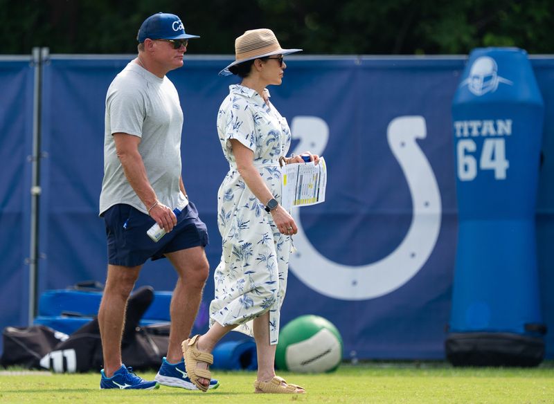 Chris Ballard, Indianapolis Colts general manager, talks Friday, July 25, 2025, with Colts owner Carlie Irsay-Gordon during training camp held at Grand Park in Westfield.
